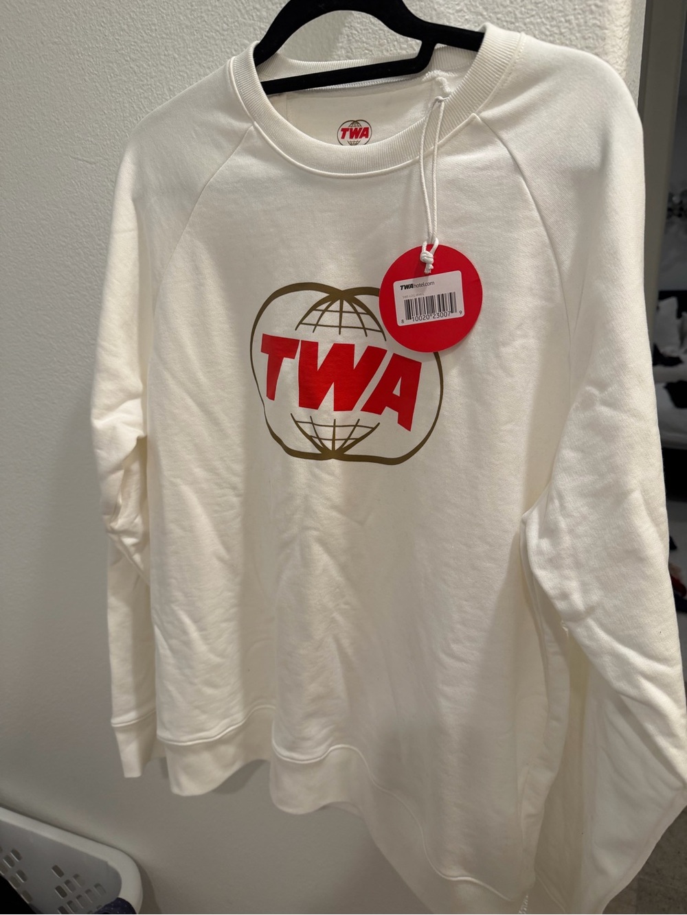 Unisex Cream Crewneck Sweatshirt with Red Logo